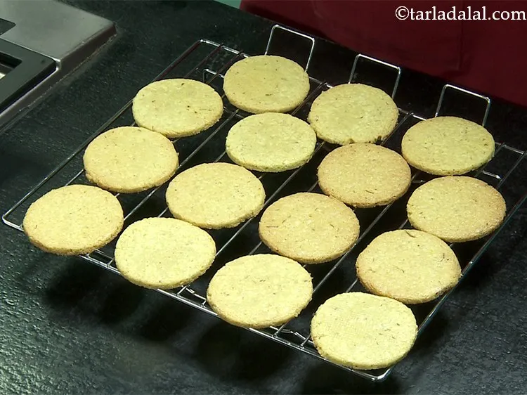 Step 38 – Transfer the <strong>Kaju Badam Puri </strong>on a wire rack to cool completely. This will take …