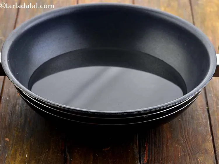 Step 1 – In a kadhai, boil about 1 cup of water.