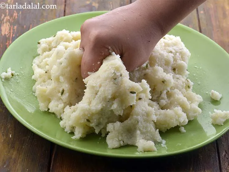 Step 9 – Knead the semolina mixture to form a smooth dough. Apply a little ghee on your …