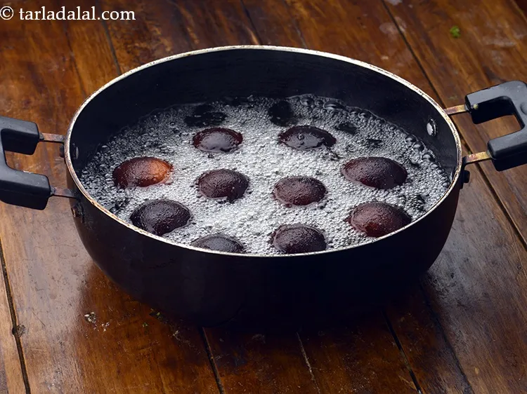 Step 22 – Cook them on a medium flame till they turn blackish in colour from all the …