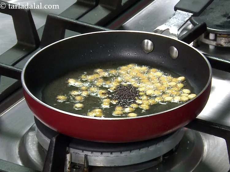 Step 38 – Then add the mustard seeds.&nbsp;