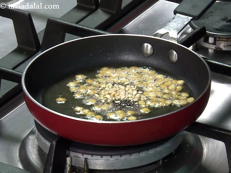 Step 39 – Also add urad dal, which is very important in most South Indain tempering.&nbsp;