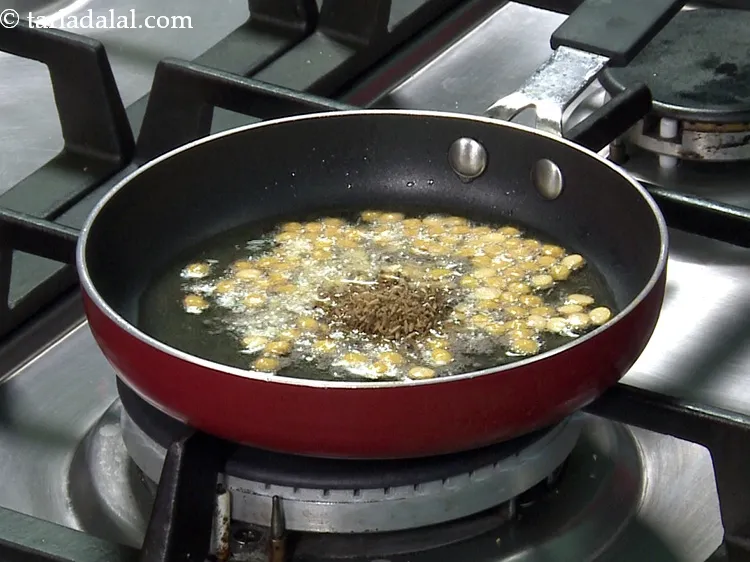 Step 40 – Add the prepared cumin seeds-peppercorn mixture.&nbsp;