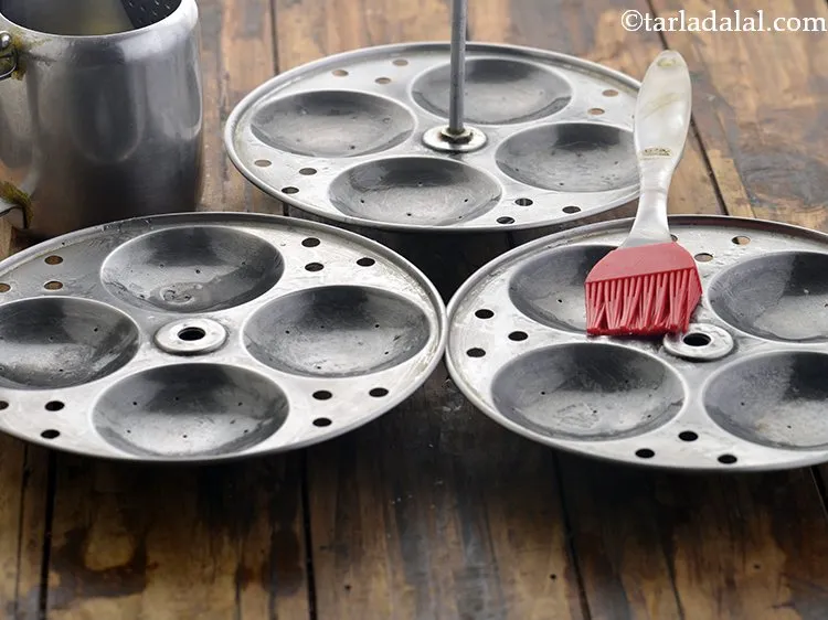 Step 50 – Grease the idli mould with little oil. This step of greasing makes the demoulding of …