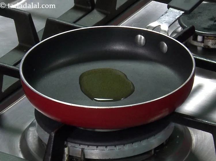 Step 35 – Next heat the sesame oil and ghee in a small non-stick pan for tempering. Using …