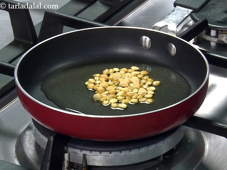 Step 36 – Add chana dal to it.&nbsp;