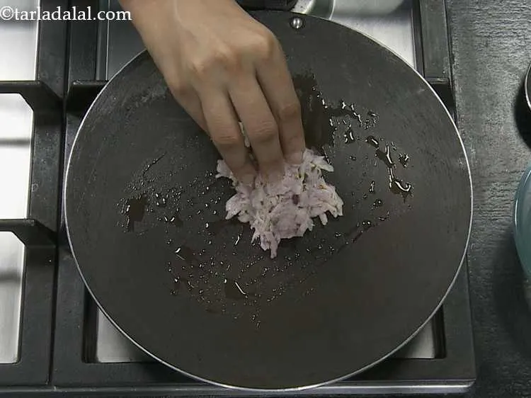 Step 7 – Once the ghee is hot, wet your fingers and put one portion of the mixture …