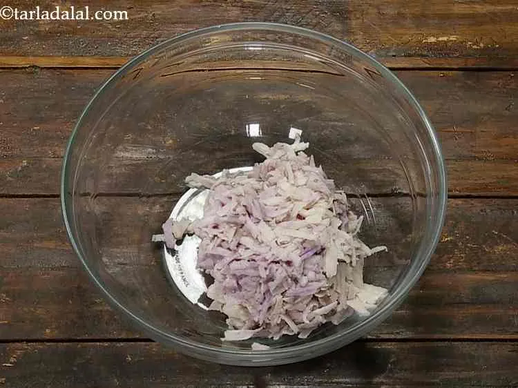 Step 1 – Take a clean, deep mixing bowl and put the grated purple yam in it. Grate …