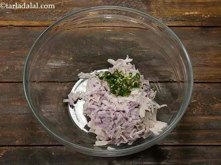 Step 2 – Add the finely chopped green chillies for a spicy kick.