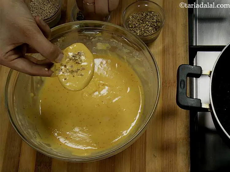 Step 11 – Once coated with the batter, without putting the slice down, first sprinkle a pinch of …