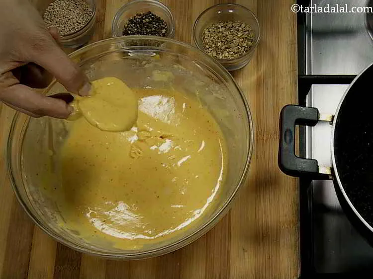 Step 10 – Dip each slice of yam into the batter so that the slices are evenly coated …