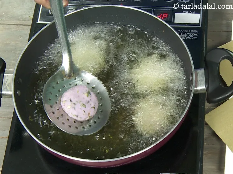 Step 20 – Heat the oil in a deep non-stick pan and add a few tikkis at a …