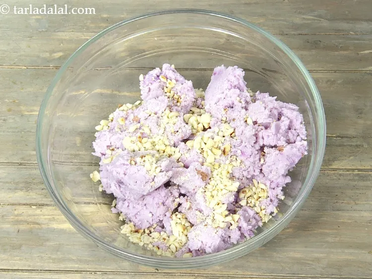 Step 10 – Add 2 1/2 tbsp&nbsp;coarsely&nbsp;<a href="https://www.tarladalal.com/glossary-crushed-raw-peanuts-917i">crushed peanuts</a>. See above how to crush peanuts.