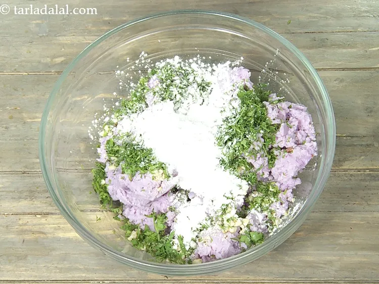 Step 12 – Add 1 1/2 tbsp&nbsp;<a href="https://www.tarladalal.com/glossary-arrowroot-flour-arrowroot-ka-atta-paniphal-flour-111i">arrowroot (paniphal) flour</a>. This helps in binding.