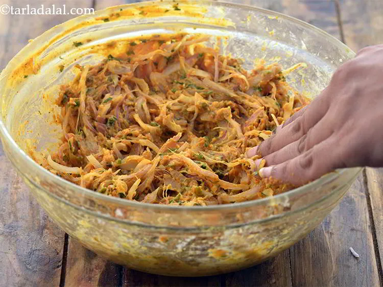 Step 15 – Add the water gradually till the besan coats the onions well. We have used approx. …