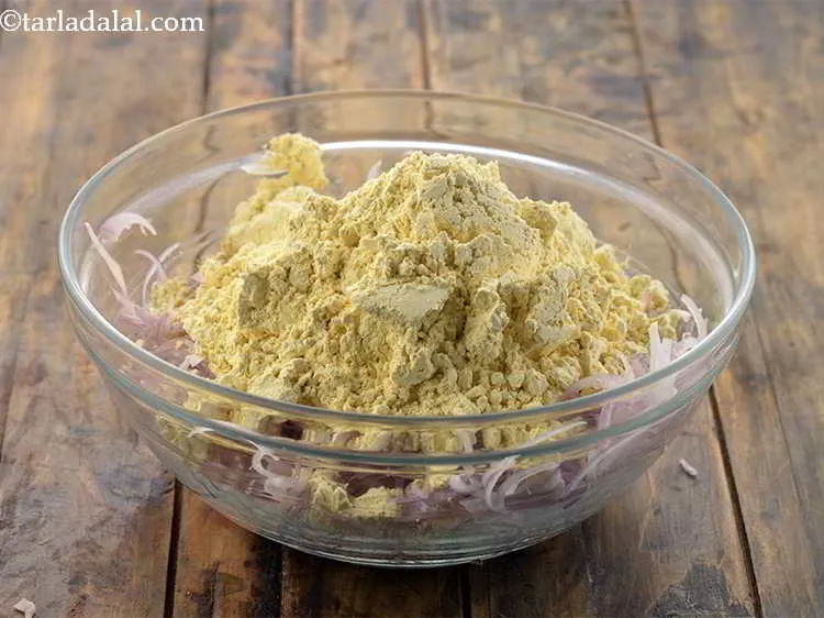 Step 8 – To this add besan. It helps in binding together all the ingredients.