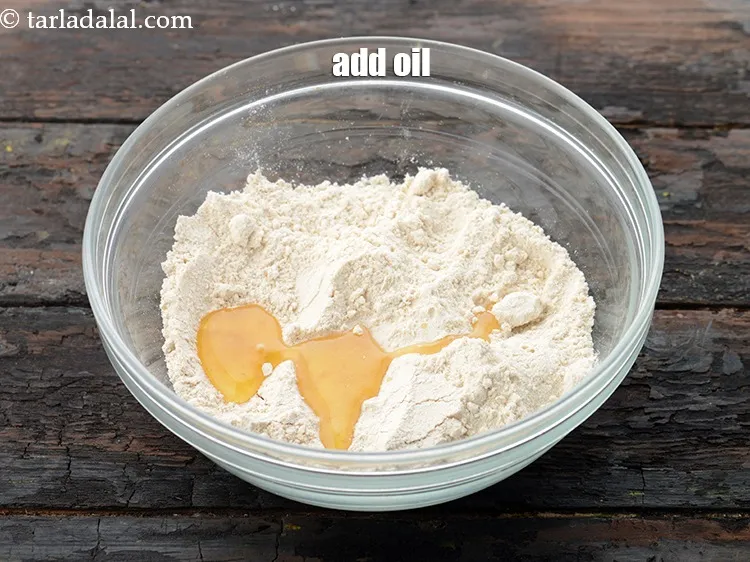 Step 14 – Add 1 tbsp&nbsp;<a href="https://www.tarladalal.com/glossary-oil-671i">oil</a>.&nbsp;
