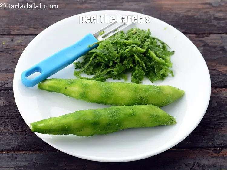 Step 5 – Peel the karelas using a peeler.&nbsp;