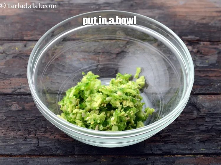 Step 7 – Transfer the grated karela in a deep bowl.&nbsp;