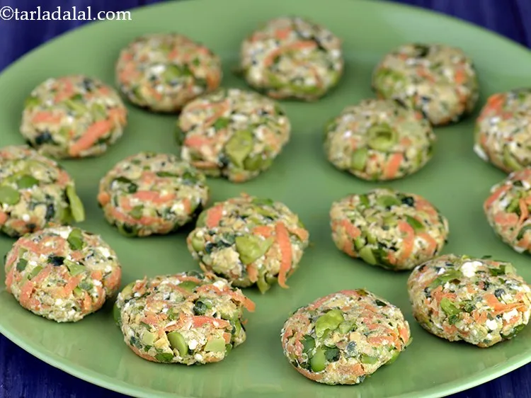 Step 18 – Shape each portion into 50 mm. (2&rdquo;) flat round tikki by rolling it in between …