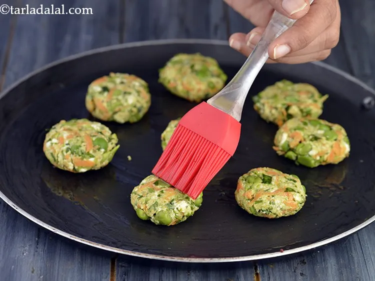 Step 21 – Cook each <strong>Bitter gourd Cutle</strong>t, using 1/2 tsp of oil, till it turns golden brown …