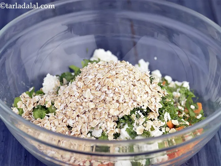 Step 12 – Now add another fiber rich ingredients &ndash; oats. These are for binding the <strong>Karela Cutlets</strong>. …