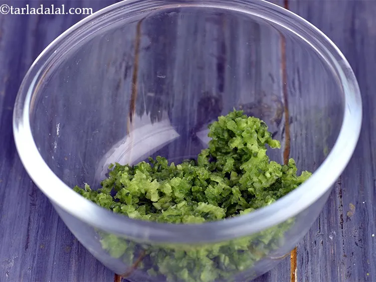 Step 7 – Now place this grated bitter gourd in a deep bowl.