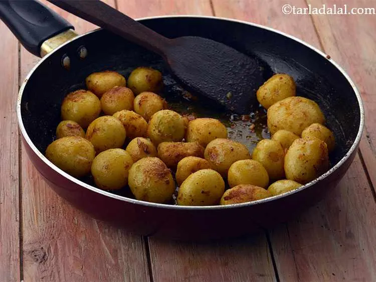 Step 26 – Mix gently and cook on a medium flame for 5 minutes.