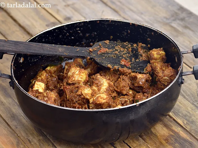 Step 36 – Add the fried jackfruit, mix well and cook on medium flame for 2 minutes, while …