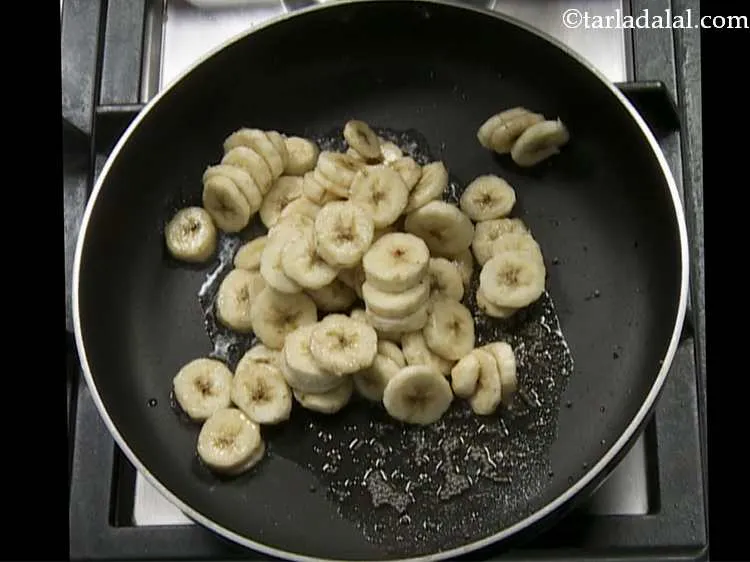 Step 11 – Add the bananas. Many people would think that we have to use raw bananas here …