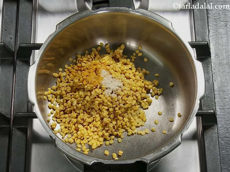 Step 11 – To this, add the turmeric powder and asafoetida (hing)