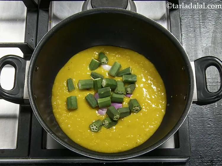 Step 18 – Now we will add other vegetables one by one. Add the ladyfinger (okra/bhindi).