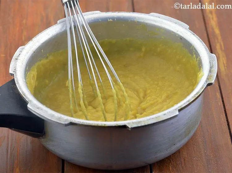 Step 15 – Now whisk the dal well using a whisk. Alternately, you can use a hand blender …