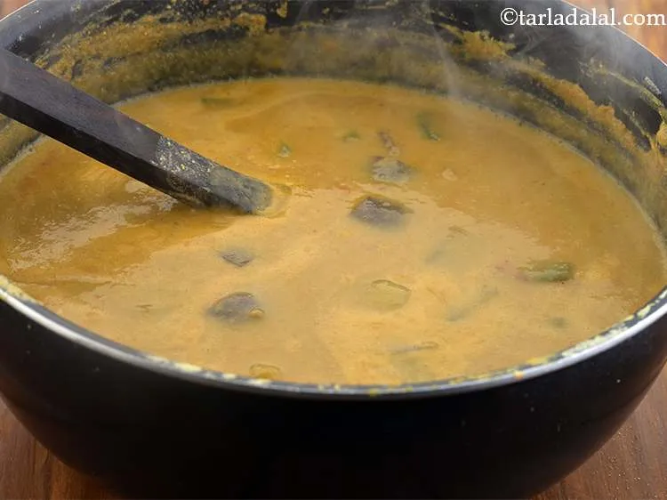 Step 27 – Finally add &frac34; cup of water, mix well and cook on a medium flame for …