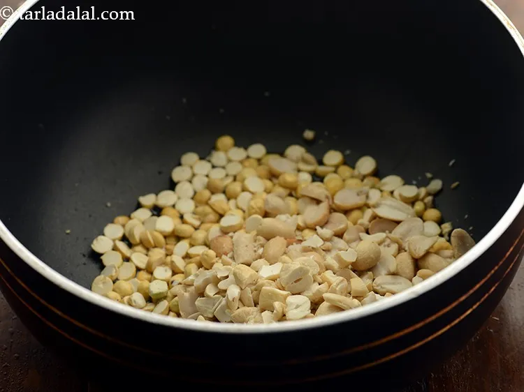 Step 5 – Add roasted chana dal, peanuts and cashewnuts. Cashewnuts, peanuts and chana dal will give a …