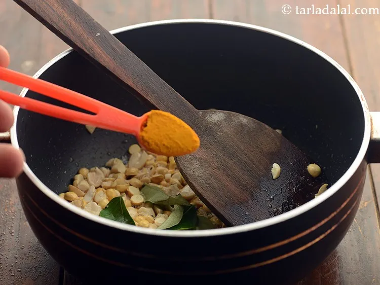 Step 8 – Add turmeric powder.