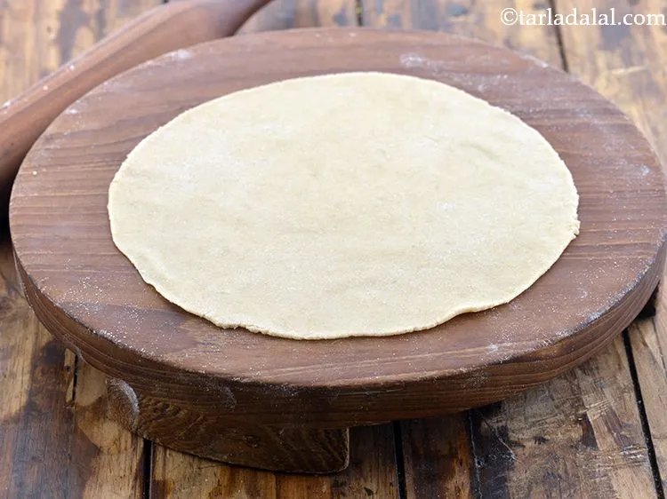 Step 26 – Roll out a portion of the dough into a 200 mm. (8&quot;) diameter thin circle, …