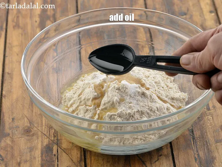 Step 5 – <meta charset="UTF-8" />Add 1 tbsp&nbsp;oil&nbsp;to condition the dough.&nbsp;<br /> &nbsp;
