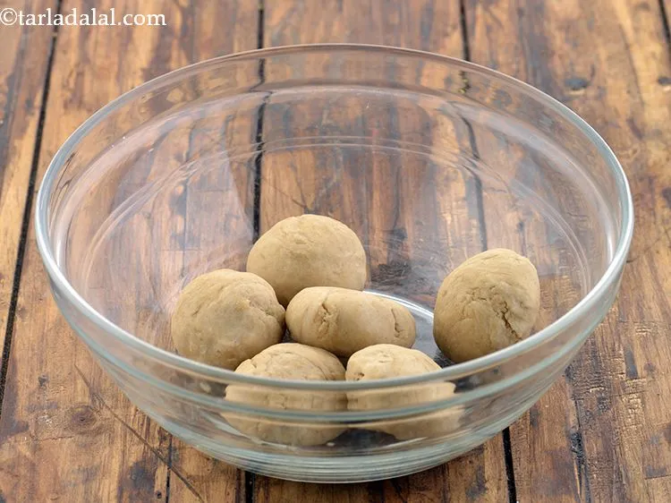 Step 23 – To make the <strong>whole wheat khakhra</strong>, divide the dough into 6 equal portions.