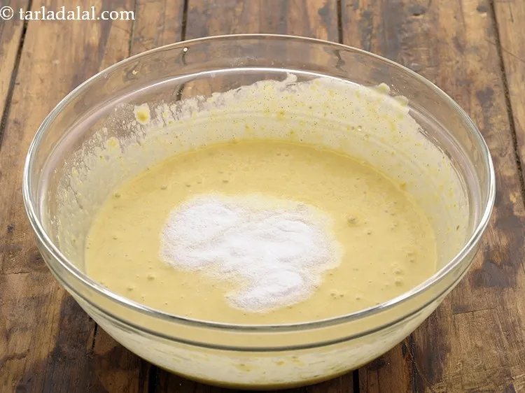 Step 10 – Just before cooking the <strong>instant khaman dhokla</strong>, add the fruit salt.