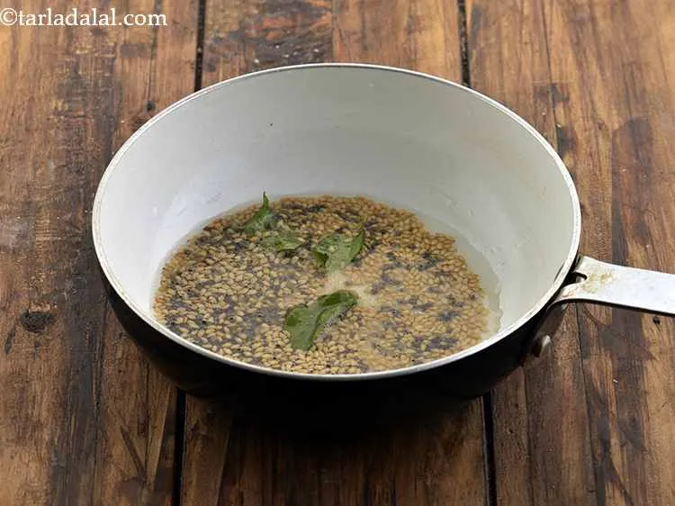 Step 17 – Add the asafetida and curry leaves. Hing aids in digestion, making you not feel bloated.