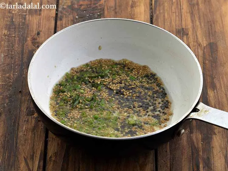 Step 18 – Add the green chillies and saut&eacute; on a medium flame for 30 seconds.