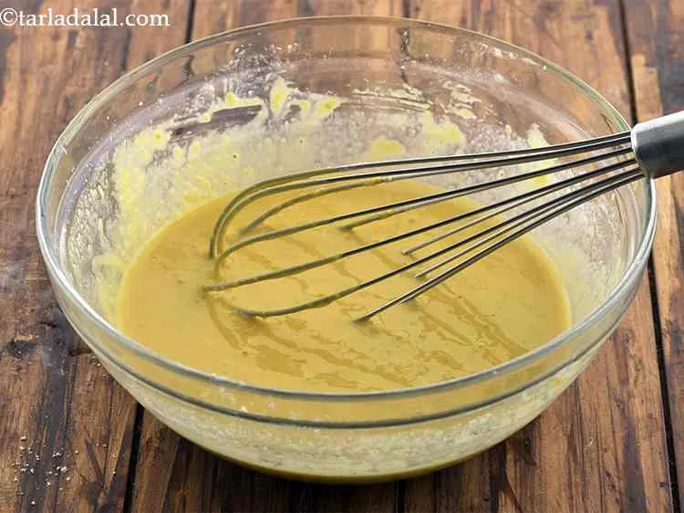 Step 9 – Mix well using a whisk to get a smooth batter.