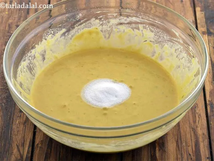 Step 10 – <p>Just before steaming, add <span style="background-color:rgb(255,255,255);color:rgb(0,0,0);">1 tsp </span><a href="https://www.tarladalal.com/glossary-salt-namak-table-salt-418i#ing_2803"><u>fruit salt</u></a>. We have used neutral flavored …