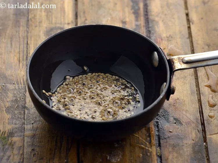 Step 29 – Add asafoetida and saut&eacute; on a medium flame for a few seconds.