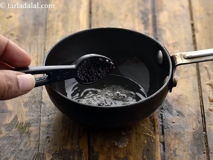 Step 27 – Once the oil is hot, add mustard seeds.