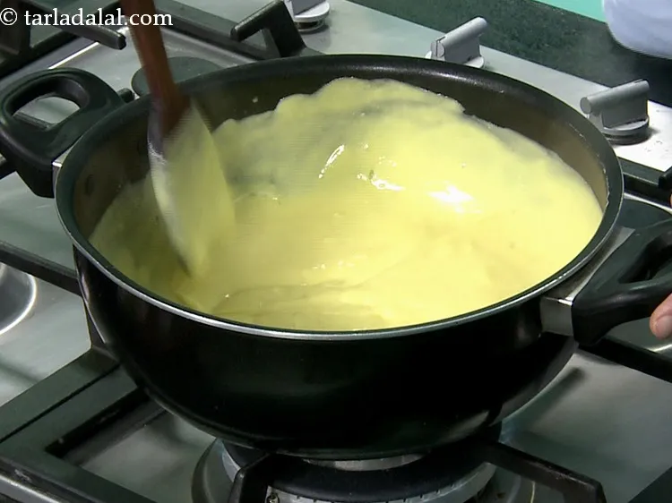 Step 14 – Switch on the flame and cook on a low flame for 9 minutes, while stirring …