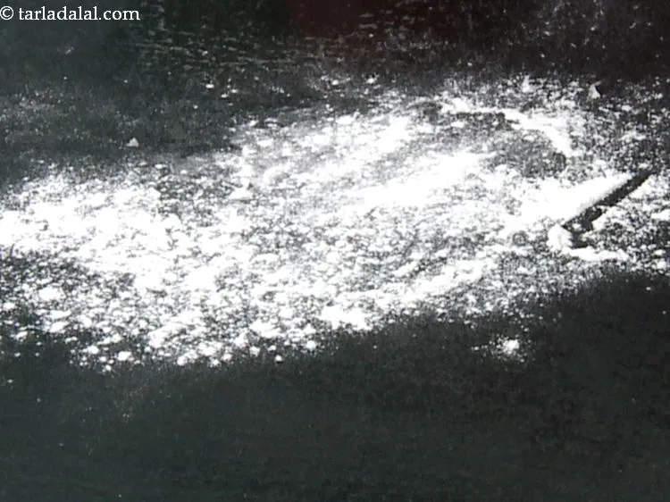 Step 10 – Dust a clean, flat surface with plain flour. Take enough flour so it is easy …