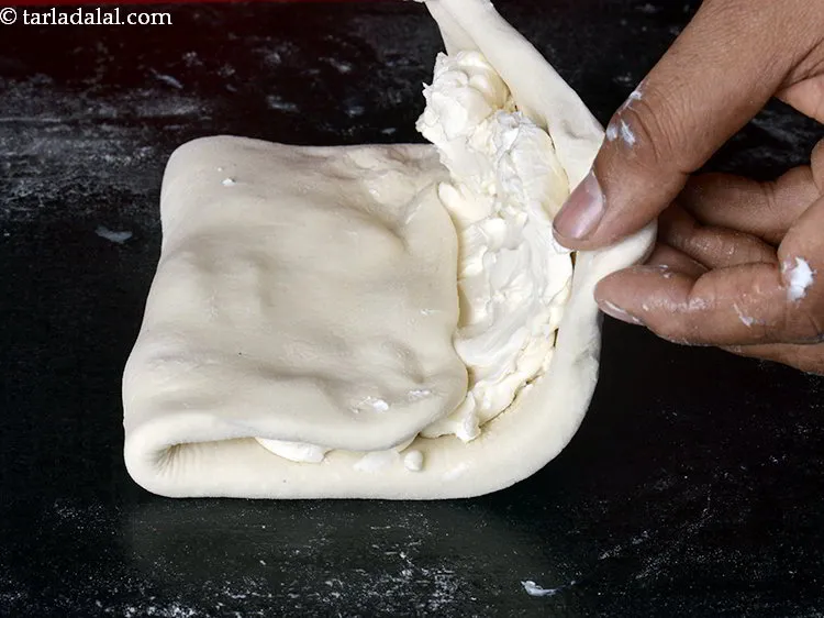 Step 13 – Fold 1/3 of the dough with no margarine side till the centre 1/3 of the …
