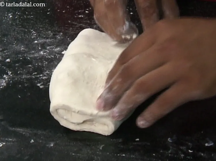 Step 14 – Then fold the margarine portion over it so that both the portions overlap each other.